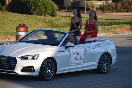 homecoming maids on back of convertible